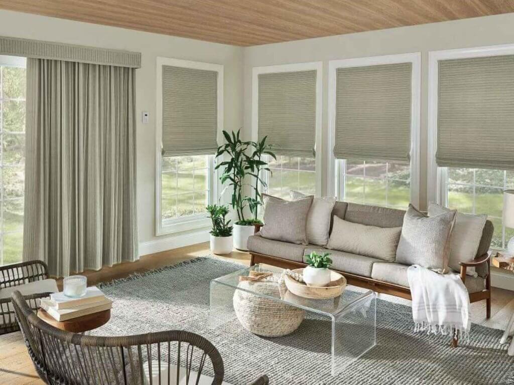 Living room with natural Graber woven wood shades filtering sunlight