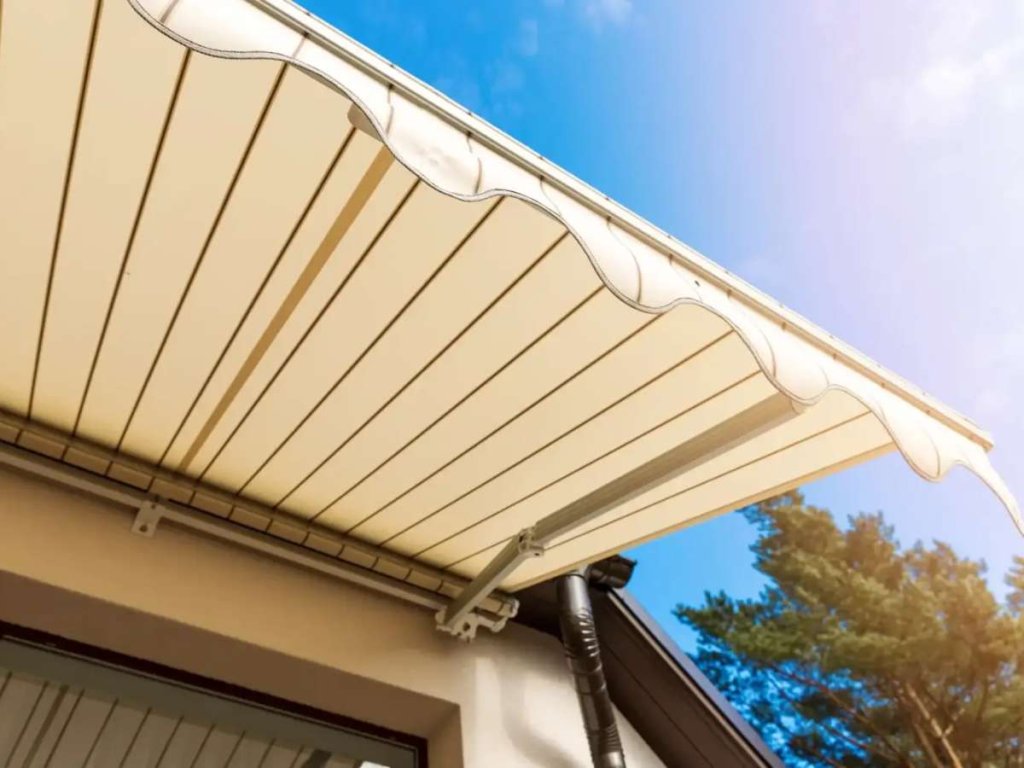 Retractable awning over a door, offering convenient shade and protection.
