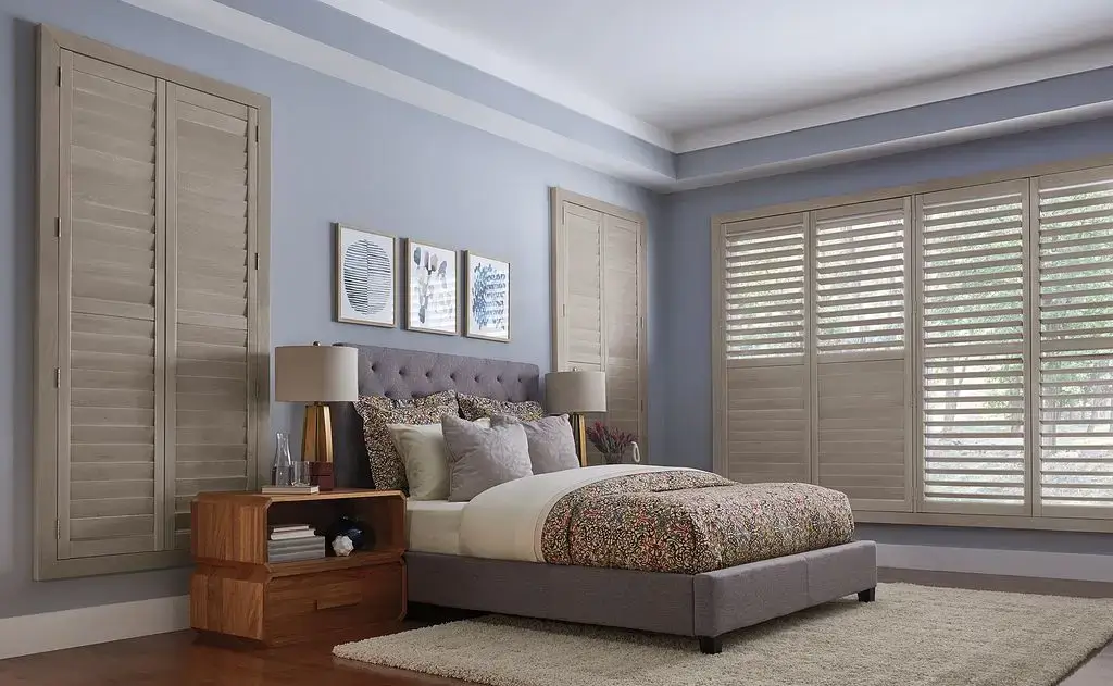 Graber Tan-Colored Wood Shutters in Bedroom Windows
